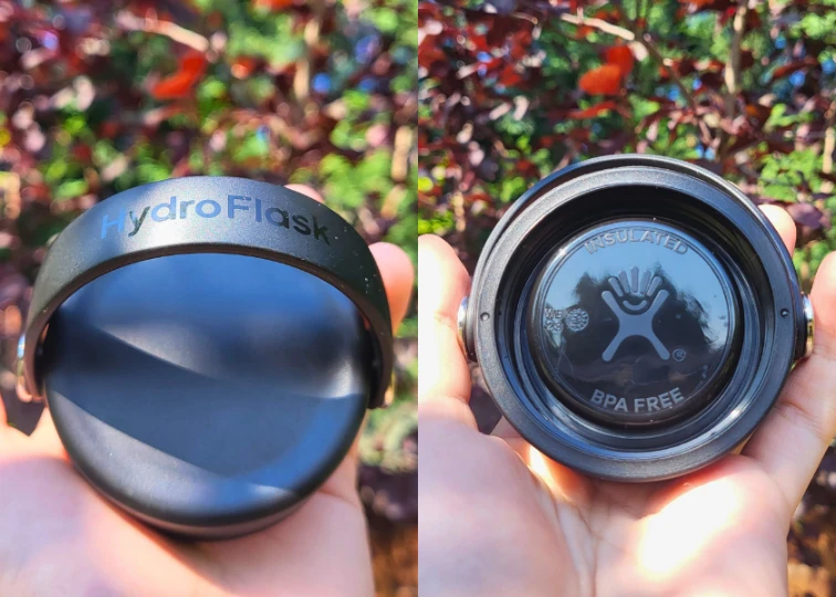 Close-up of a Hydro Flask water bottle lid, featuring the embossed “Hydro Flask” logo on a black background.