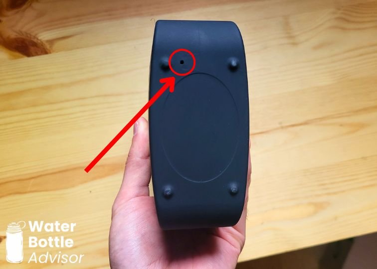 Piurify Flask hydrogen water bottle base showing the byproduct release hole marked with a red arrow and circle