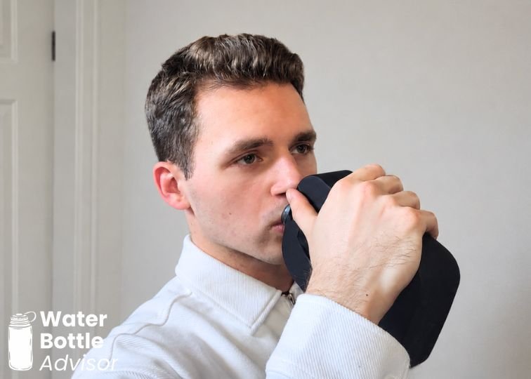 Jeremiah Kowalski demonstrating the proper way to drink from the Piurify Flask hydrogen water bottle