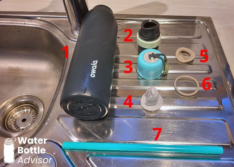 Owala FreeSip Twist 24 oz bottle disassembled into seven parts for cleaning