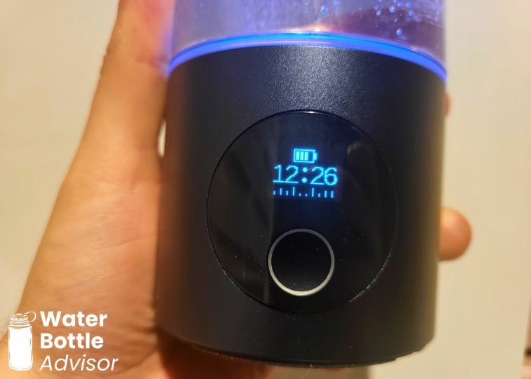 Close-up of the Piurify Hydrogenator hydrogen water bottle touchscreen display showing the timer and battery icon