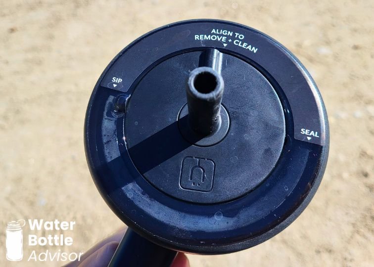 Close-up of the BrüMate Era 30 oz tumbler showing the three-position lid with sip, seal, and clean settings