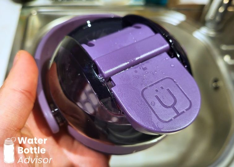 Close-up of the BrüMate MultiShaker bottle lid showing the purple flip cap