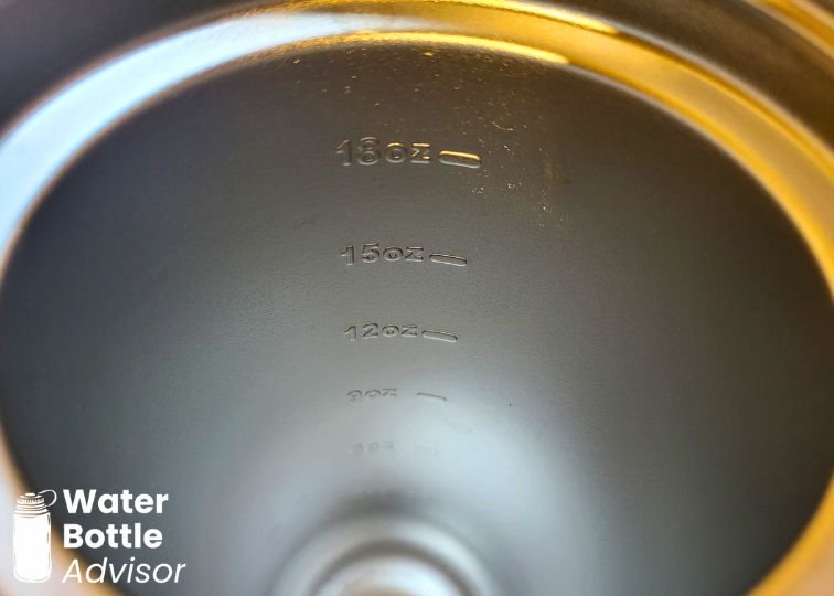 Close-up of the BrüMate MultiShaker bottle showing the internal measurement markings