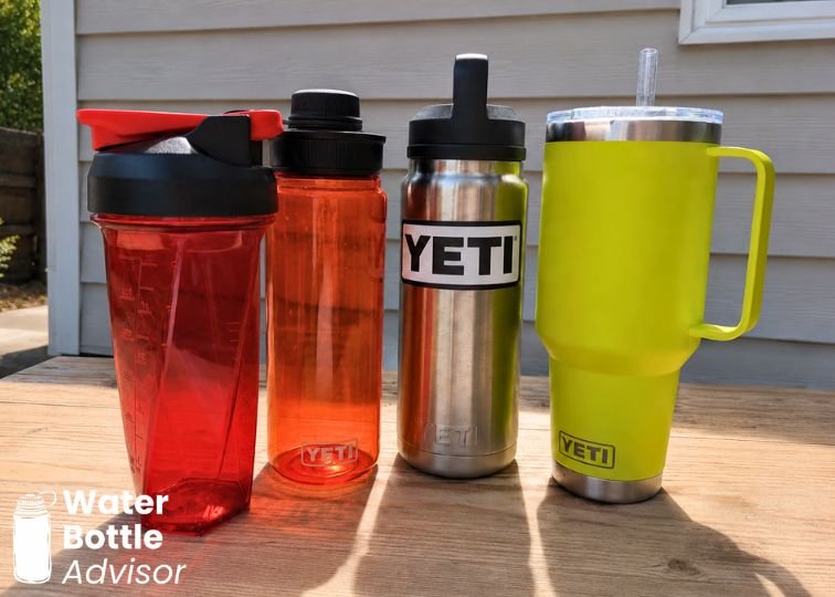 Helimix shaker, YETI Yonder bottle, YETI Rambler bottle, and YETI Rambler tumbler lined up on an outdoor table