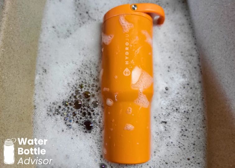 HydroJug Sport Tumbler 32 oz being cleaned in soapy water