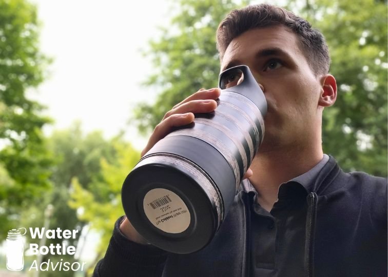 Jeremiah Kowalski drinking from the Coldest 32 oz black water bottle outdoors