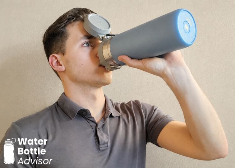 Jeremiah Kowalski drinking from the Stanley Quick-Flip Go 24 oz bottle indoors