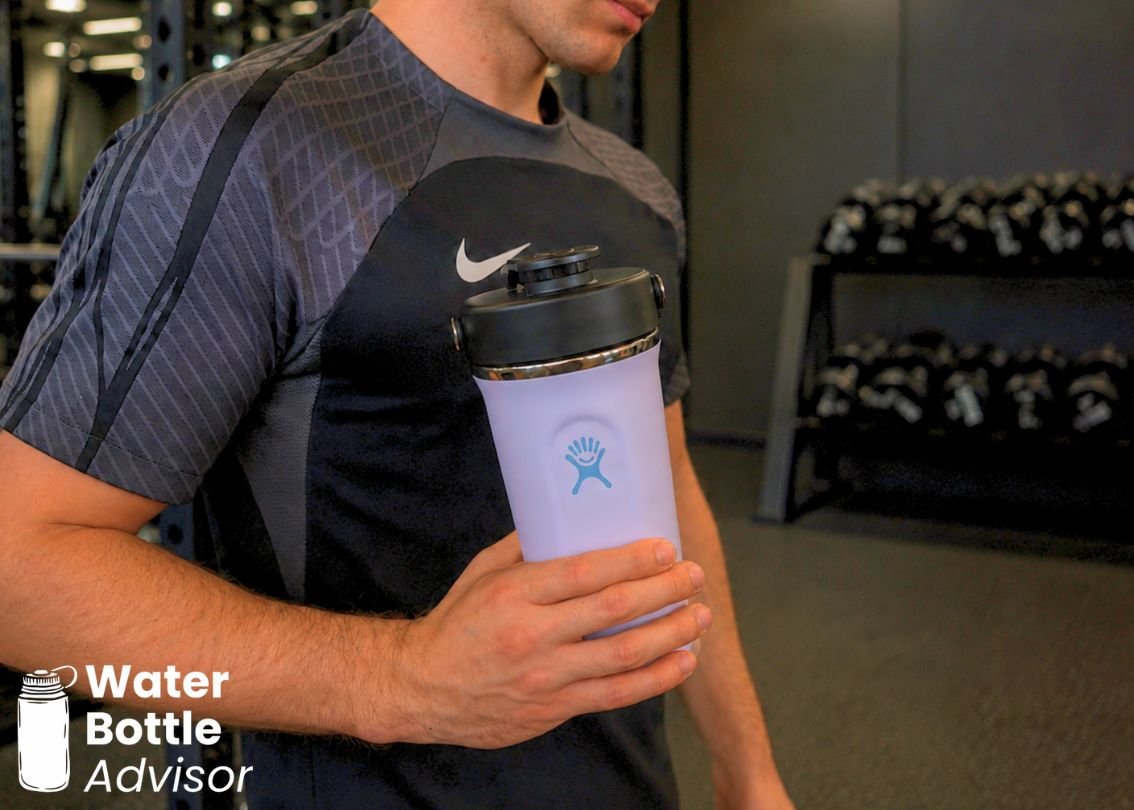 Jeremiah Kowalski holding the Hydro Flask Shaker bottle in a gym