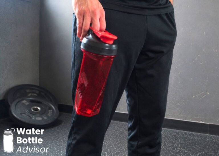 Jeremiah Kowalski holding the YETI Yonder shaker bottle by the lid handle in a gym