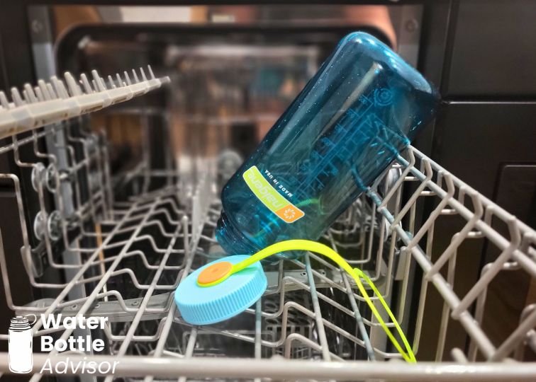 Nalgene 32 oz wide mouth bottle placed upside down in a dishwasher rack with the lid attached