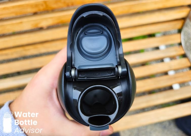Close-up of the Owala FreeSip Bottle showing the dual drinking spout with the lid open