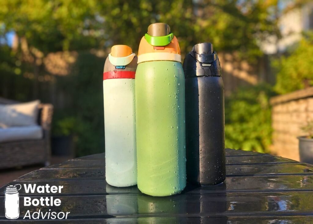 Three Owala FreeSip bottles shown side by side outdoors for size and design comparison