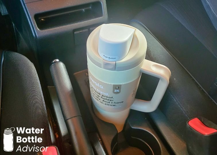 Owala FreeSip Tumbler 30 oz sitting in a car cup holder