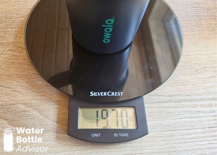 Owala Tumbler 40 oz weighed empty on a digital kitchen scale showing 19.70 oz