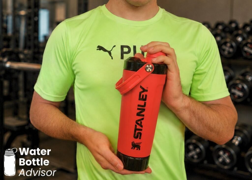 Person holding the Stanley Vitalize Shaker Bottle in a gym