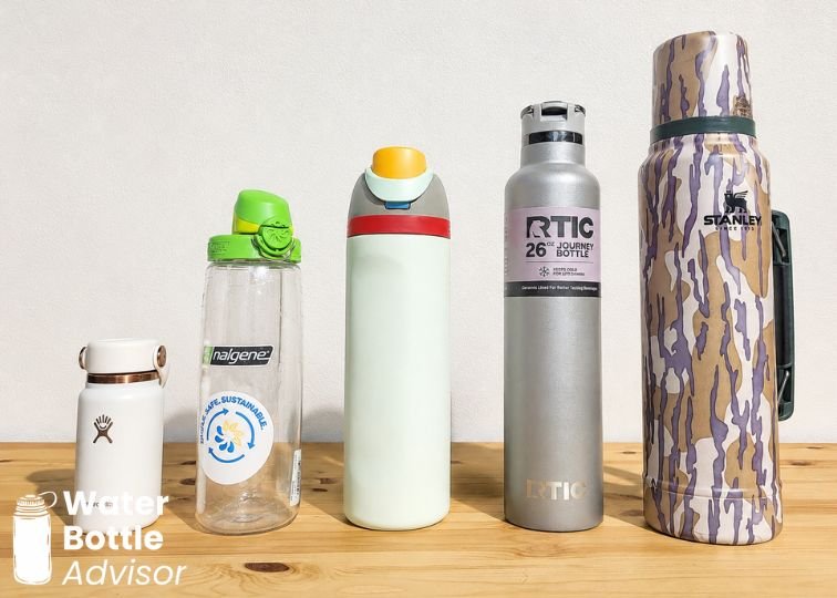 Reusable water bottles in different sizes lined up on a wooden surface for size comparison