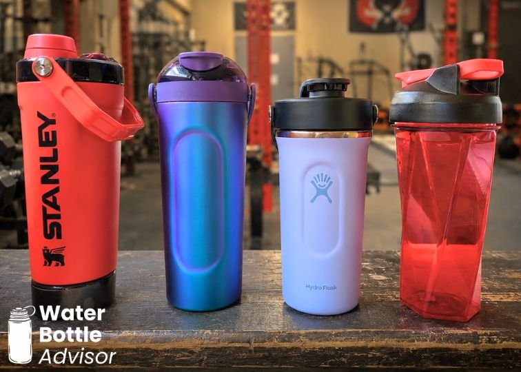 Stanley Vitalize Shaker, BrüMate MultiShaker, Hydro Flask Shaker, and Helimix shaker bottle lined up in a gym