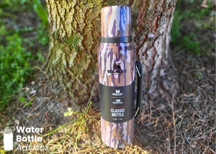 Stanley Classic Legendary Bottle 1.1 QT standing outdoors against a tree