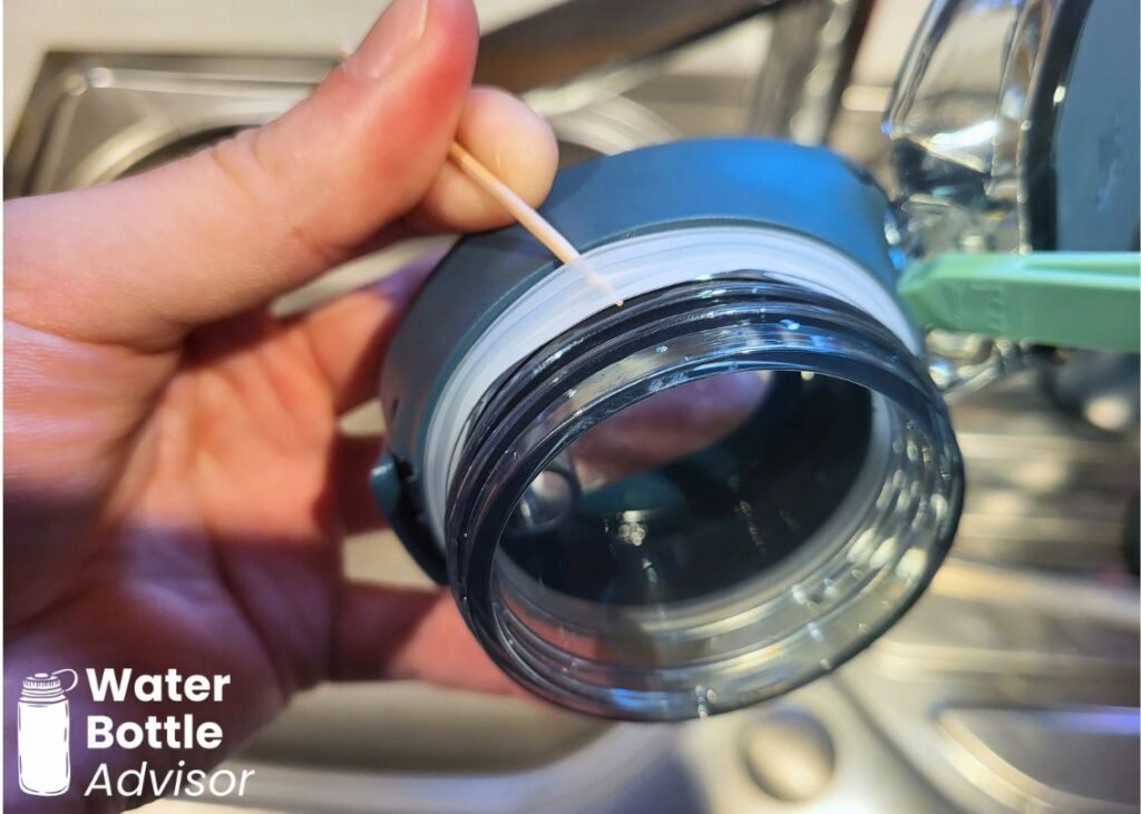 Close-up of the Stanley FlowState Spring Bottle showing the silicone gasket being removed from the threaded lid