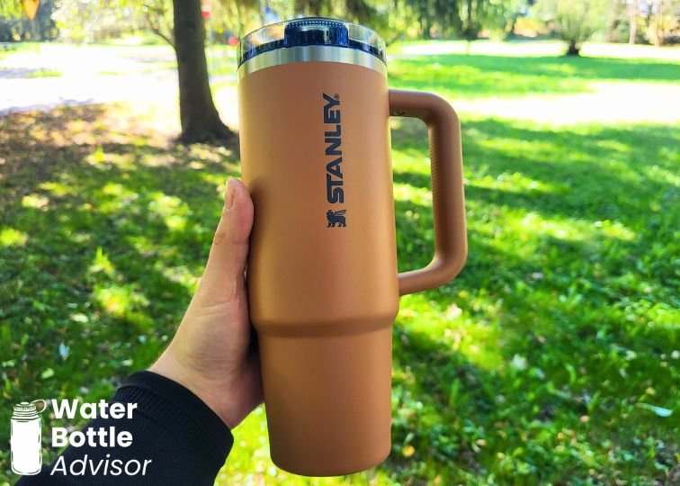 Stanley ProTour Tumbler 30 oz being held outdoors in a park