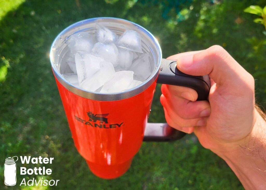 Stanley Quencher H2.0 FlowState 30 oz tumbler filled with ice and held outdoors
