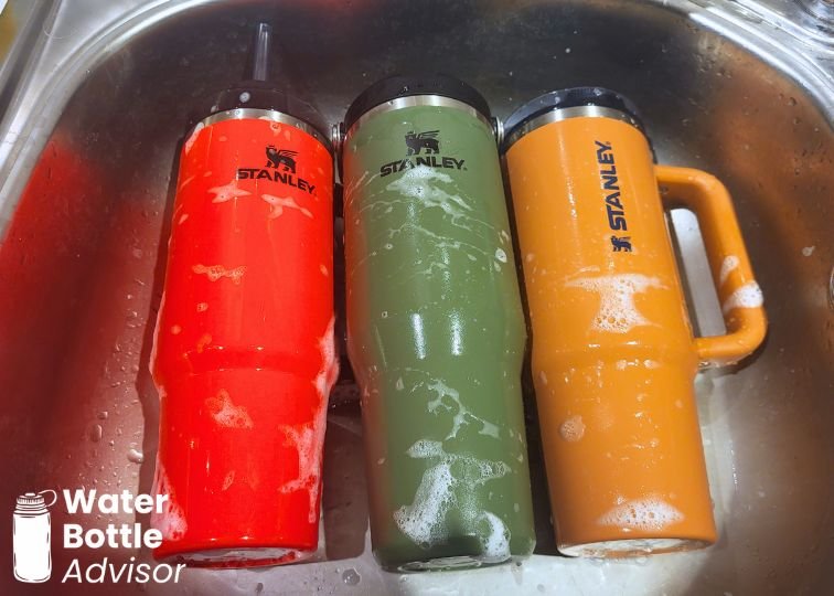 Stanley Quencher 30 oz, Stanley IceFlow 30 oz, and Stanley ProTour 30 oz tumblers being cleaned in a sink