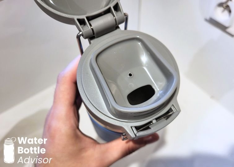 Close-up of the Stanley Quick-Flip Go lid showing the drinking opening with the flip cap open