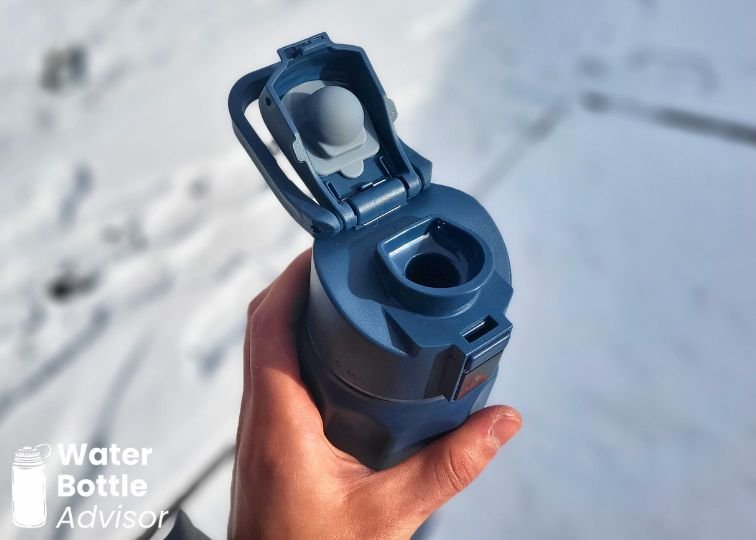 Close-up of the WaterH BOOST 32 oz smart water bottle with the lid open showing the drinking spout