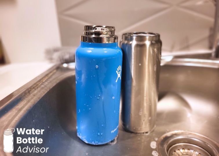 YETI Rambler 26 oz and Hydro Flask 32 oz bottles standing in a kitchen sink after rinsing